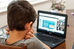 Child looking at a screen