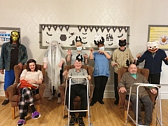 Both residents and staff dressed up before enjoying party food, Halloween bingo and dancing