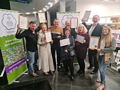 Norden in Bloom volunteers with their awards, including Andrew Nutter, Emma Metcalfe, Paul Ellison, Christine McHugh, Angus Pickup, Kath Bentley, Phil Starr and Sian Hegarty