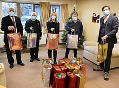 The Rochdale District Freemasons donating the gift bags at the hospice with Sam Wells, CEO of Springhill Hospice