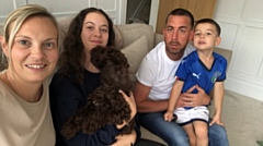 Tim Greenwood, based at Rochdale Police Station, will run 10 miles a day for 30 consecutive days throughout March (pictured with his family)