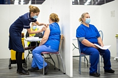 Vaccine being given at Mass Vaccination Centre at the Etihad Tennis Centre