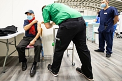 Vaccination given at the mass vaccination centre at the Etihad