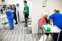 A patient receiving a vaccination at the mass vaccination centre in east Manchester