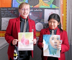 Harriet Whitbread and Ella Raw with their artwork