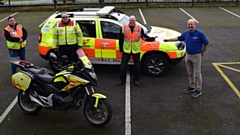 The cheque was presented by President David Jones to Alan Burrill of Blood Bikes