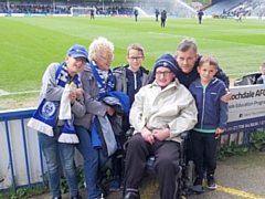 David Clough (third from right) at a Rochdale match