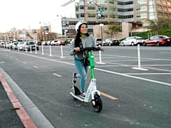 A Lime E-scooter in action