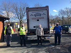 Leader of the council, councillor Allen Brett with community warehouse volunteers