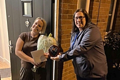 Sue Sutton being presented with her award by RCT volunteer coordinator Lauren Sullivan