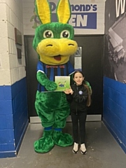 Dale Mascot Desmond the Dragon gives a book away