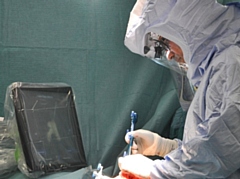 Orthopaedic surgeon, Mr Bonshahi performing robotic assisted surgery