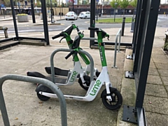 Lime E-scooters parked outside Nye Bevan House on Maclure Road