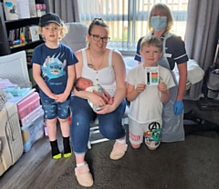 Sarah Carrington, baby Henry 4 weeks, Joshua aged 7, Elyot aged 6 and Health Visitor Louise Wileman.