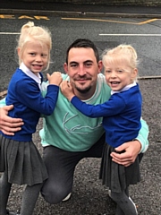 Dad Daniel Clegg, from Rochdale, with twin daughters Pippa and Isobelle