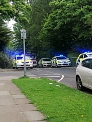 The large police presence on Foxholes Road at the top of Red Lane