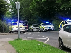 The large police presence on Foxholes Road at the top of Red Lane