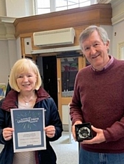 Cathy Entwistle, foodbank co-ordinator and Steve Field, chair of trustees with the award