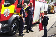 Firefighter Chelsea Thomason and Apprentice Firefighter Scott Leach with Zain