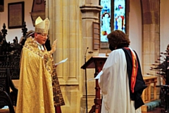 Bishop of Middleton, Rt Revd Mark Davies, blesses Revd Anne Gilbert at St Chad's on 29 June