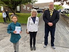 10-year-old logo winner Amelia Newbury of 40th Rochdale Scout Group with FOSAC chair Tricia Ayrton and Friends member Richard Lord