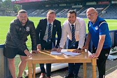 Dale Keogh (Rochdale AFC Military Veterans), Tony Pockney (Rochdale AFC Director), Ryan Bradley (Community Director) and Steve Colesby (Rochdale AFC Walking Football) sign off on the agreement

 