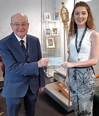 Councillor Billy Sheerin presents Sophie Ansley from Springhill Hospice with a charity cheque, pictured inside the Mayor's Parlour at Number One Riverside