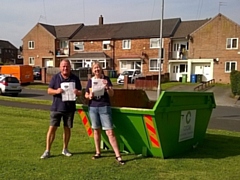 Cllr Phil Burke and Riverside housing officer Alison Roberts with one of the skips