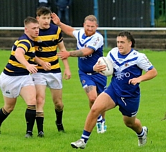 Max Wood (right) playing his last game for Mayfield before signing with Wigan Warriors