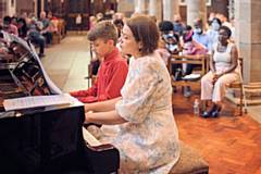 Margarita Capas performs a duet with one of her students