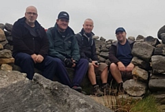 Dispatch supervisor Angie Hopkinson and HGV drivers Darren Hibbert, Chris Bullock, John Bauld, Andrew Blackshaw, Peter Nolan and Richard Kopiki will be climbing Snowdon on Monday (pictured: four of the drivers on a training walk)