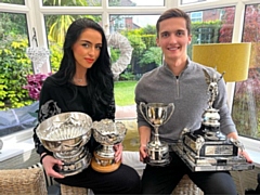 Mia Linnik-Holden and Andrei Toader with some of their trophies