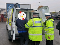 Police arresting the chicken thief, with an appropriate emoji to conceal his identity