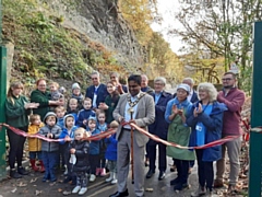 Official cutting of the ribbon at Dell Road, with the Mayor or Rochdale, fellow councillors, Tony Lloyd MP plus children and staff from the tea rooms and Aunt Mary's Day Nursery.