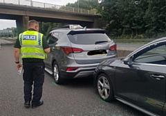 John brought the ill driver's car to a stop using his own car