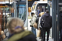 People queuing for a bus