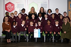 The Rights Respecting School Council receiving their gold certificate with Kathryn Gorton (front left) and Catherine Mullane (front right) both lead teachers for Rights Respecting Schools with Headteacher Aleksandra Hartshorne (back left) and Assistant Head Claire Smith (back right)