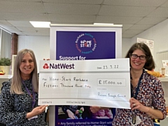 £15,000 cheque presented to Donna McKenna with Jo Oliver, programme delivery service manager from the council's environmental management service