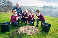 Headteacher, Richard Walthall and pupils at Stansfield Hall Primary School in Littleborough helped to plant 200 trees