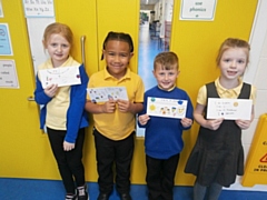 Hollins Primary pupils with some of their letters to Ukraine 