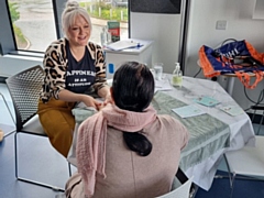 Sue from Lakeside Therapies and Chelle from The Beauty Barn (pictured) provided relaxing hand massages and reflexology