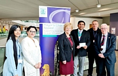 The Rochdale Veterans' Breakfast Club received a cheque from Councillor Aasim Rashid