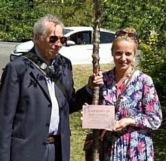 Sue’s husband John with daughter Diana who holds a memorial plaque