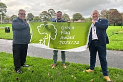 Colin Mottershead (Friends of Balderstone Park) with Councillor Daniel Meredith and Councillor Phil Massey fly the Green Flag