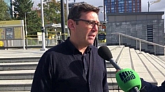 Greater Manchester mayor Andy Burnham at MediaCityUK Metrolink stop