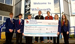 Whitworth students present James Anderson with a cheque