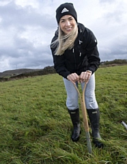 Gemma Atkinson planting the first tree in the new woodland at Bleakholt Animal Sanctuary