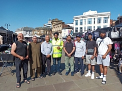 The Rochdale Riverside Traders' Association with Ghulam Rasul Shahzad OBE (third from left)