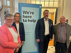 Council leader Councillor Neil Emmott and Councillor Janet Emsley, cabinet member for libraries, welcome the new service at Heywood Library with Barclays Bank staff