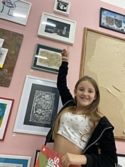 Daisy Coulter with her artwork in London ('Oh Baby!' is the very top piece)